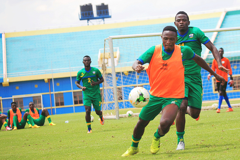 APR midfielders Djihad Bizimana (foreground) and his cousin Muhadjir Hakizimana vie for the ball during Amavubi at Amahoro National Stadium. The duo is part of the 18-man squad tha....