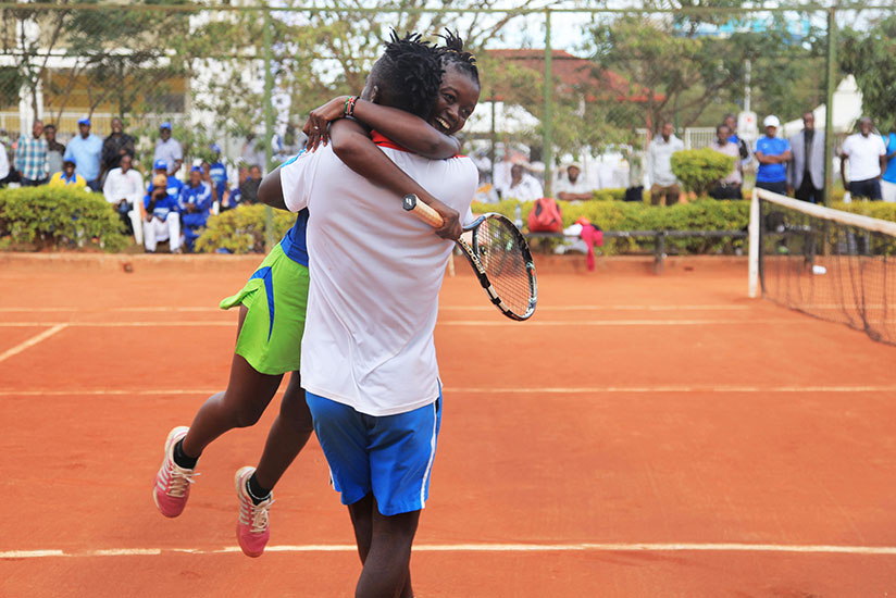 Kenyans Changawa Mzai and his sister Shufaa Changawa celebrate the victory after winning Rwanda Tennis Open on Saturday (All photos by Sam Ngendahimana)