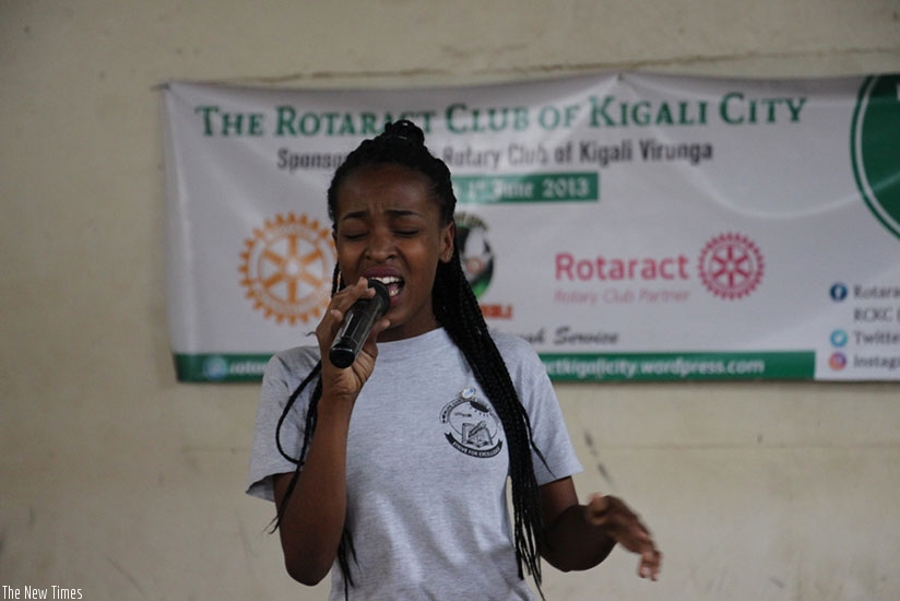 A student singing at the talent show. (Photos by Francis Byaruhanga)