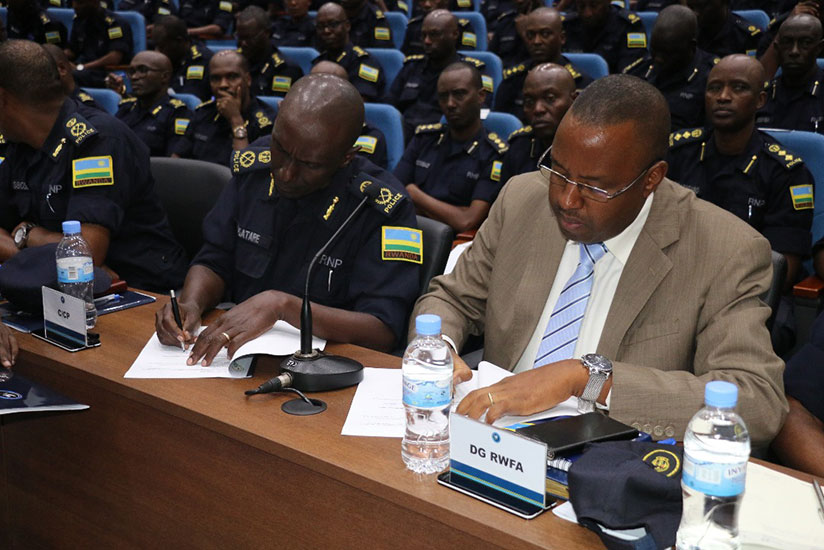 ACP Damas Gatare and the Director General for Rwanda water and forestry authority Prime Ngabonziza signing the agreement. (Courtesy)