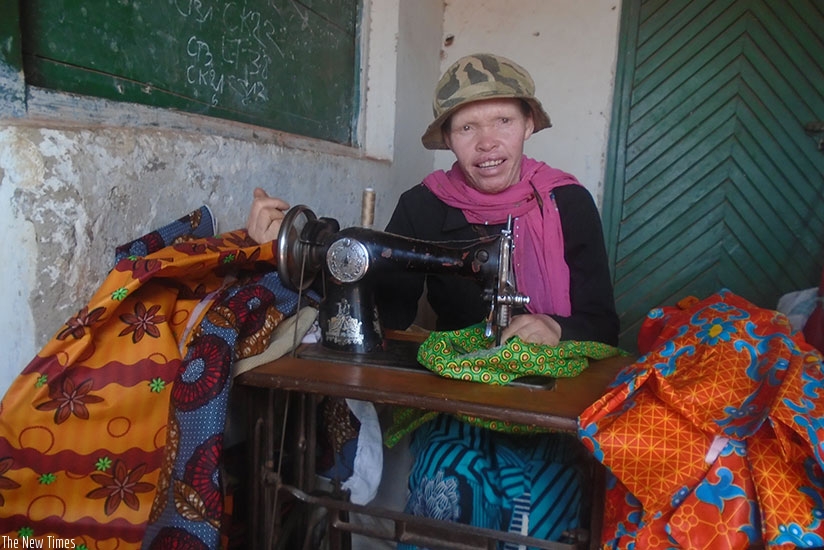 Bernadette Niyodusenga, the albino seamstress in Ngoma Sector, Huye District who transformed her life through sewing clothes. (Photos by Rermy Niyingize)