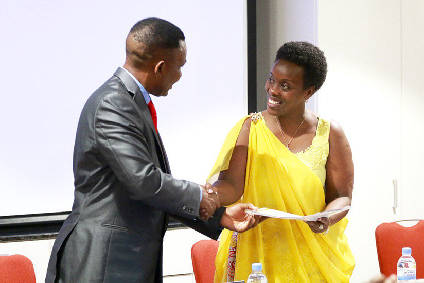 Prof. Ngwa (L) and Dr Gashumba after signing the MoU.  (Hudson Kuteesa)