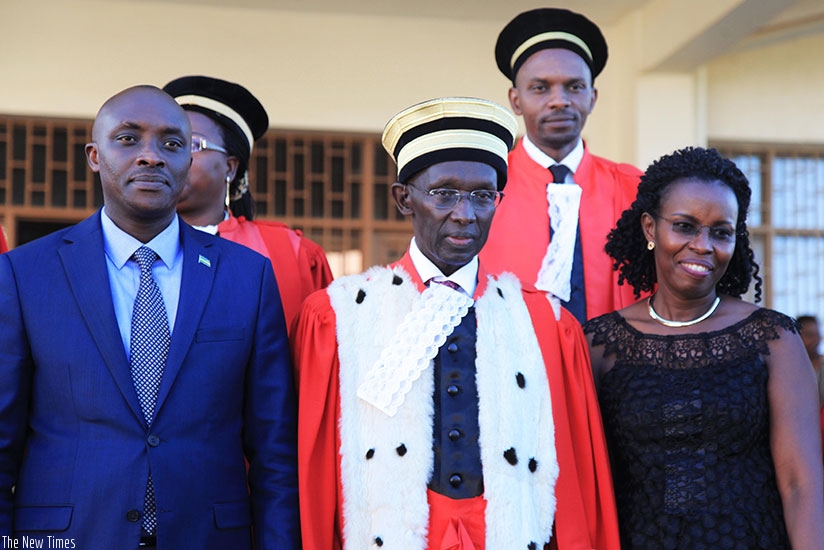 Chief Justice Sam Rugege (c) with new Rwanda Law Reform Commission chairperson Aimable Havugiyaremye (L) and deputy chairperson Beata Mukeshimana (R) after they were sworn in yeste....