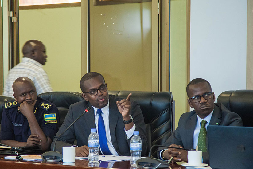 Mutangana (C) briefs the committee about drug dealing as State Minister for Legal Affairs Evode Uwizeyimana (R), and Jean-Marie Twagirayezu, the commissioner Police Criminal Invest....