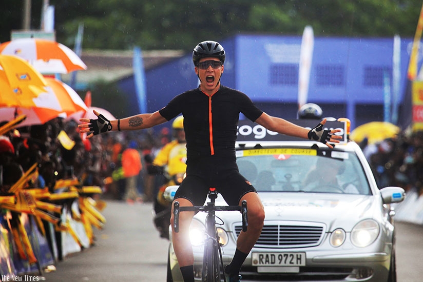 Team Illuminate rider Pellaud Simon celebrates in Rubavu yesterday.  Sam Ngendahimana.  