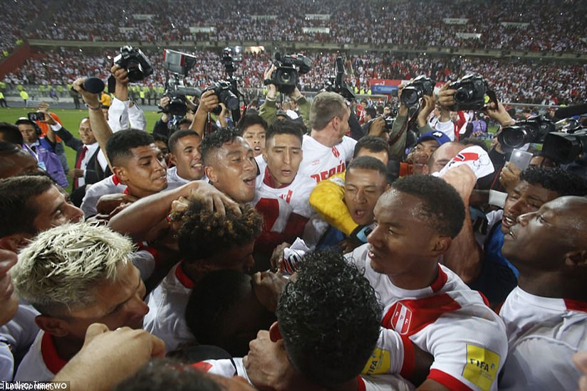Peru's players celebrate wildly after a 2-0 win over New Zealand in Lima secured their place at the World Cup finals. (Net photo)