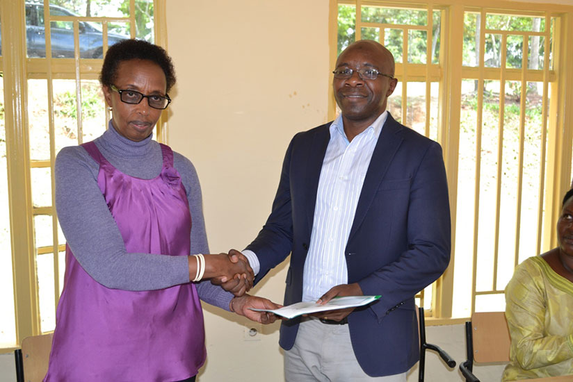 Dr. Marie-Christine Gasingirwa (left) Director General of Science, Technology and Research at Mineduc and the Principal IPRC-East Dipl.-Ing. Ephrem Musonera shake hands at the hand....