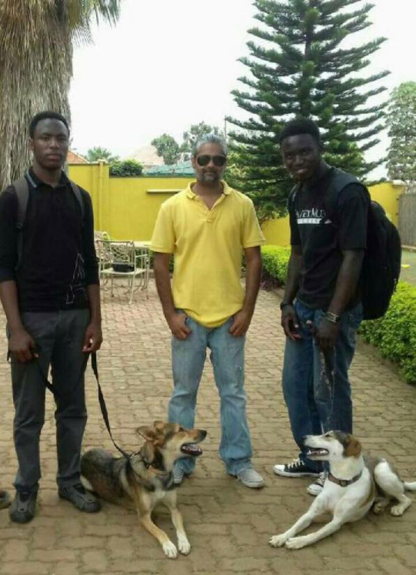 El Rahim Jaffer (centre) with some of his dog trainers.  / Jean de Dieu Nsabimana