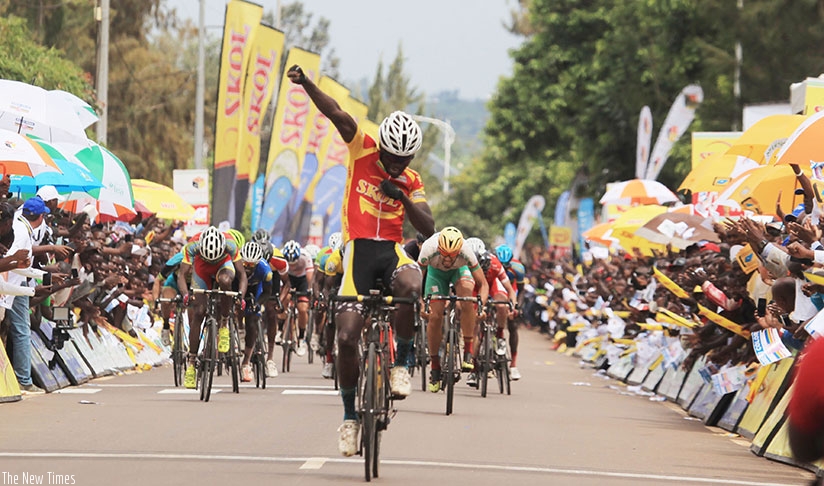 Uwizeyimana celebrates as he crosses the finish line ahead of the rest of the riders in Stage 5 of Tour du Rwanda (Sam Ngendahimana)