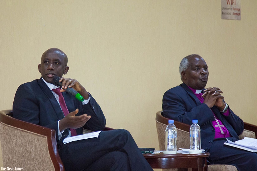 Kaboneka speaks during the RALC survey presentation about values that should characterise marriage in Rwandan culture as Archbishop Rwaje looks on. Nadege Imbabazi.