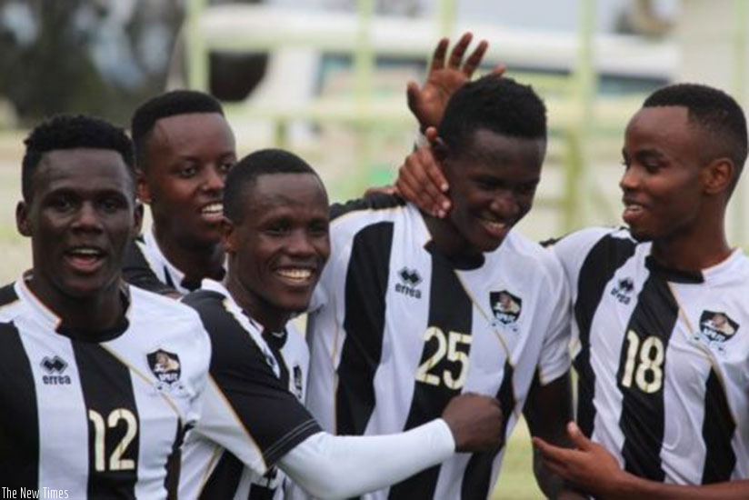 Full-back Fitina Omborenga, 2nd from right, is congratulated by teammates after giving APR the lead in the 3-0 win over Bugesera on Wednesday. Sam Ngendahimana.