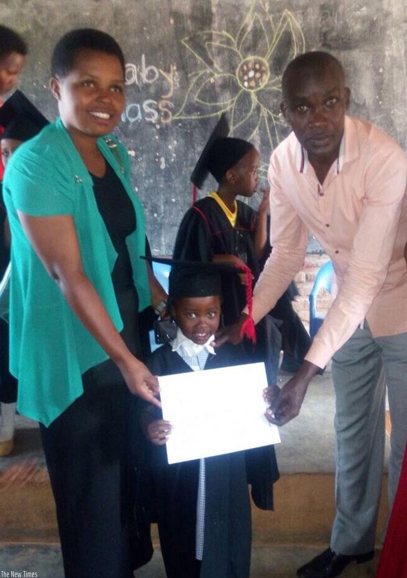 A pupil with her mother and teacher on graduation. Children should make their parents proud by performing well. (D. Agaba)