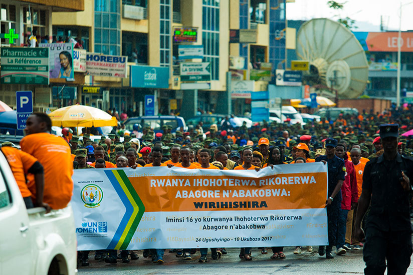 A walk to raise awareness about call to end violence against women and girls in Kigali yesterday. The walk also helped call on the role of different actors and the community in dea....