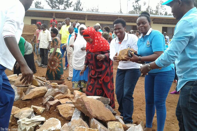 Kicukiro District officials and residents take part in the construction of an ECD centre. (File)
