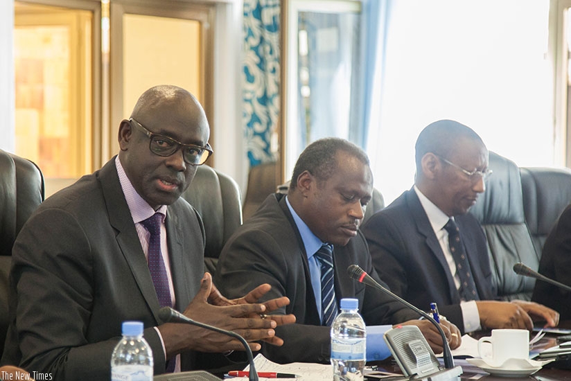 L-R; Busingye, State Minister for Economic Planning Uzziel Ndagijimana and Rwangombwa in Parliament yesterday. (Nadege Imbabazi)