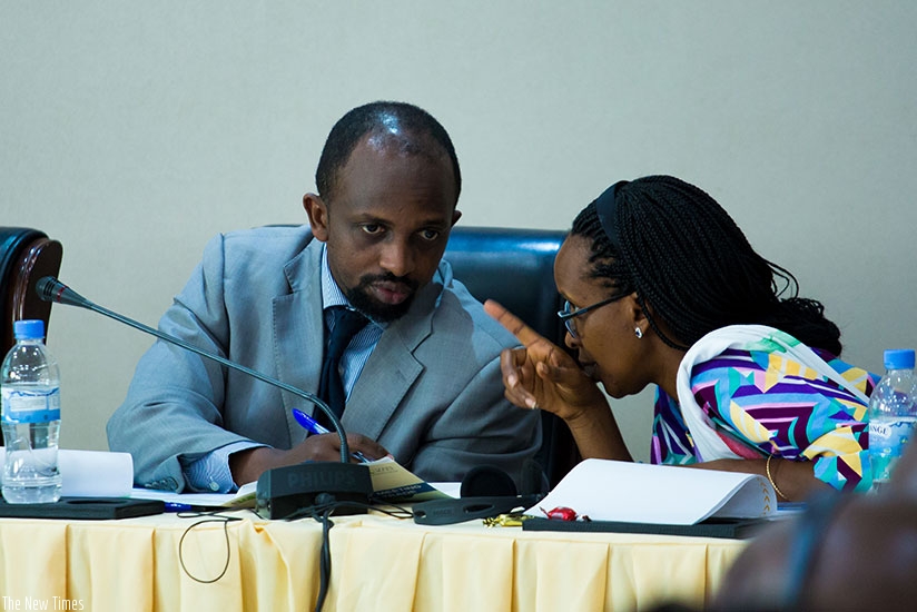 Opirah (L) consults with Bugingo during the meeting in Kigali. (Photos by Timothy Kisambira)
