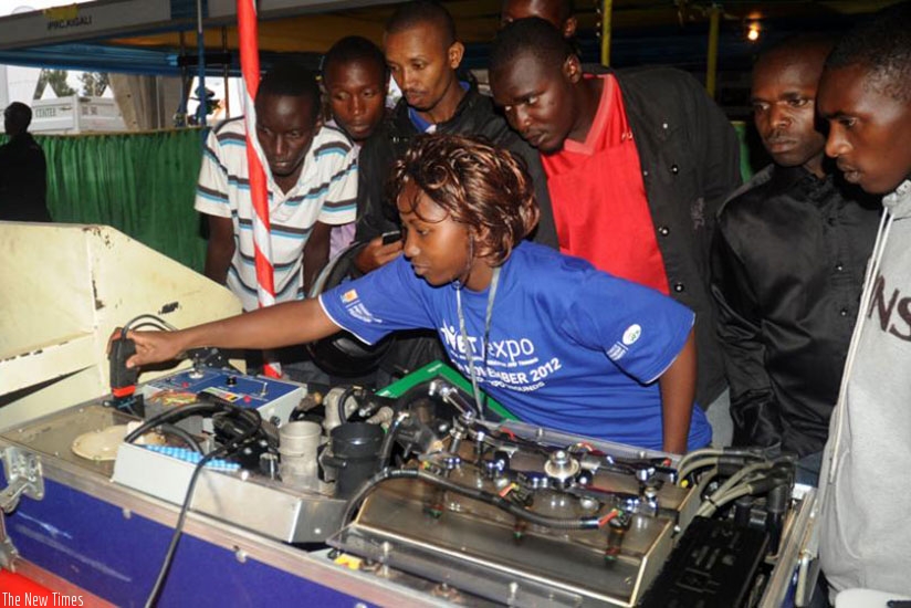 A student of mechanics explains how an engine works during a TVET expo in 2012. File.