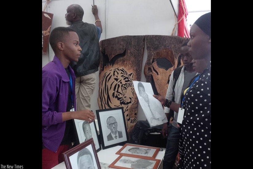Yannick Mfura, an artist and one of the exhibitors at the ongoing Made-in-Rwanda expo. Mfura of Honore Art Deal draws sketch and portraits using pencils. (Photos by Joan Mbabazi)