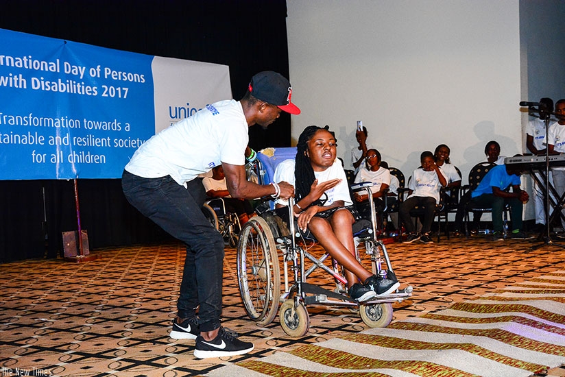 Poetess Ange Theonestine Ashimwe performs one of her poems about disability.