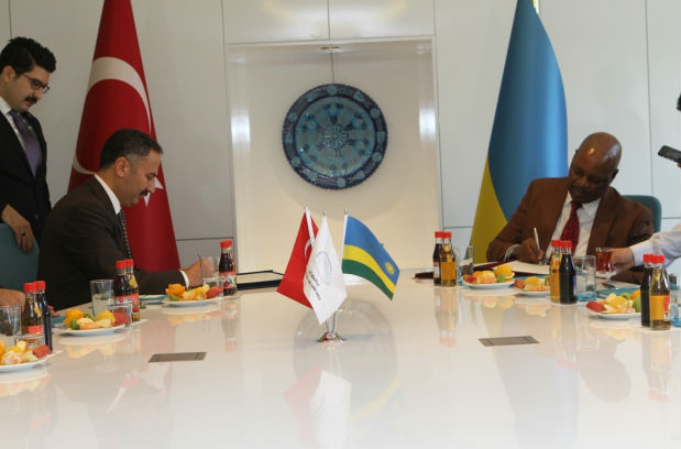Ambassador Nkurunziza signing with Mr. Yilmaz Akcil, President of Turkey's Justice Academy. / Courtesy