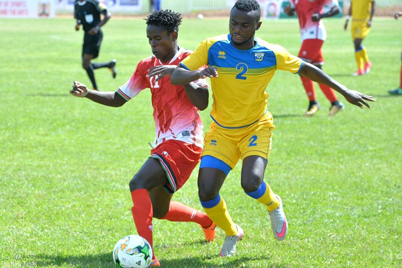 Rwanda midfielder Djabel Manishimwe  battles with Kenya's Duncan Otieno during the first half of the CECAFA  Challenge Cup opener on Sunday afternoon. Courtesy