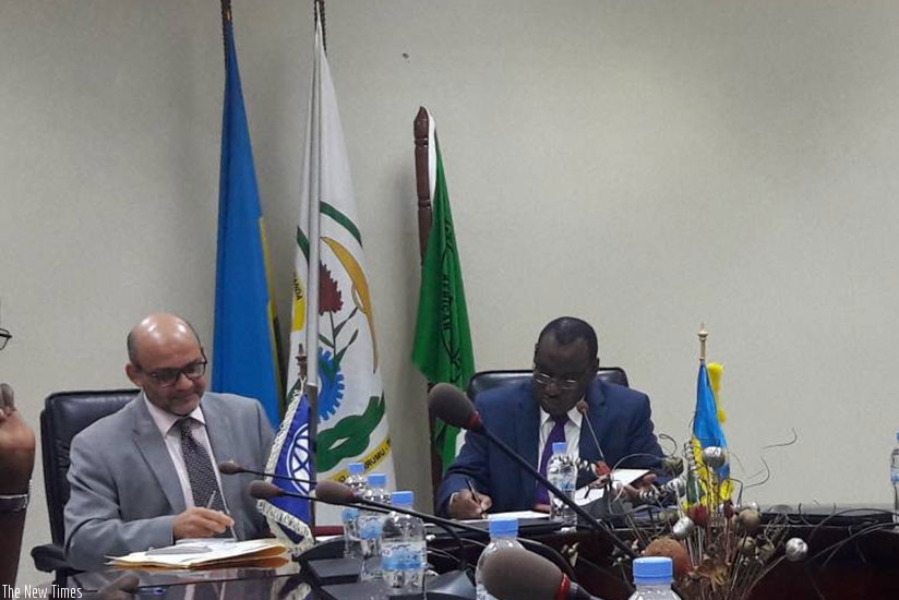 World Bank country director Yasser El-Gammal (L) and  Minister of Finance and Economic Planning Claver Gatete sign a financing agreement to support the energy sector. (Photos by Ju....