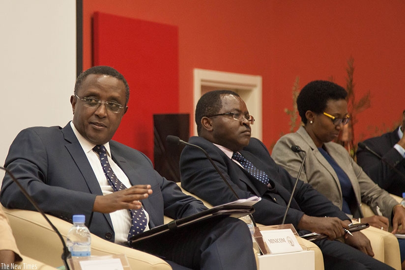 Environment minister Dr Vincent Biruta speaks as Trade and Industry minister Vincent Munyeshyaka (centre) and REMA director-general Coletta Ruhamya look on at the launch of the Gre....