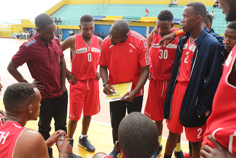 IPRC-South coach Charles Mushumba briefing players during time-out on Saturday. / Courtesy