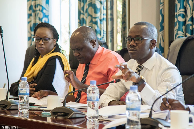 The State Minister for Constitutional and Legal affairs, Evode Uwizeyimana (R), defends the draft Penal Code before MPs last month. / File