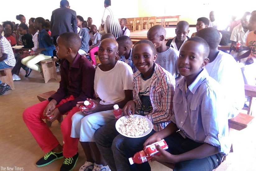 Children sharing goodies during a holiday party. Sharing is a sign of love and builds good friendships.  / Dennis Agaba.