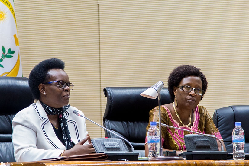 Senator Marie Claire Mukasine (L), the president of African Parliamentarians Network Against Corruption (APNAC) Rwanda Chapter, speaks as as MP Veneranda Nyirahirwa looks on yester....