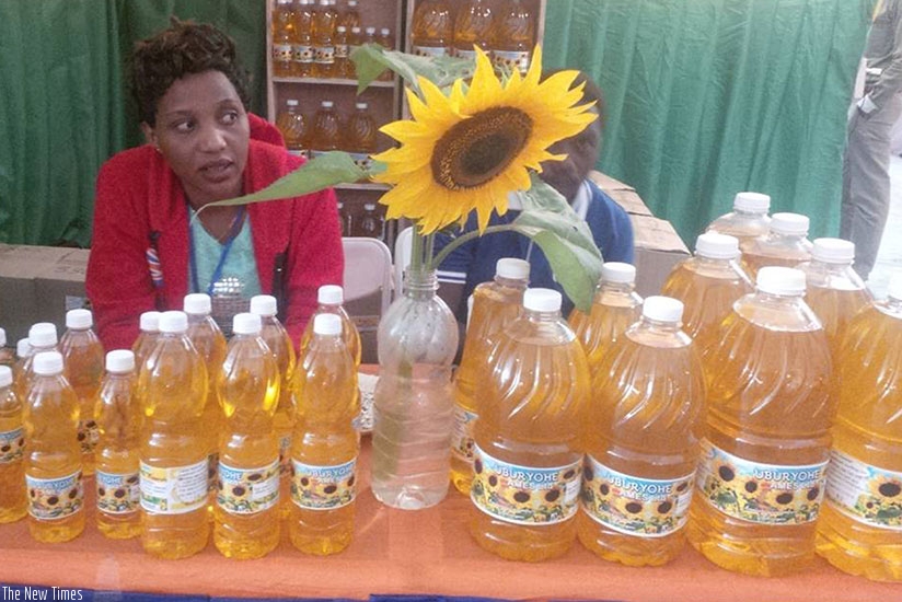 Exhibitors wait for buyers at the just-ended expo. The cooking oil is made by a local firm, Uburyohe Ames, from sunflower.  Ensuring quality and value-addition are essential for SM....