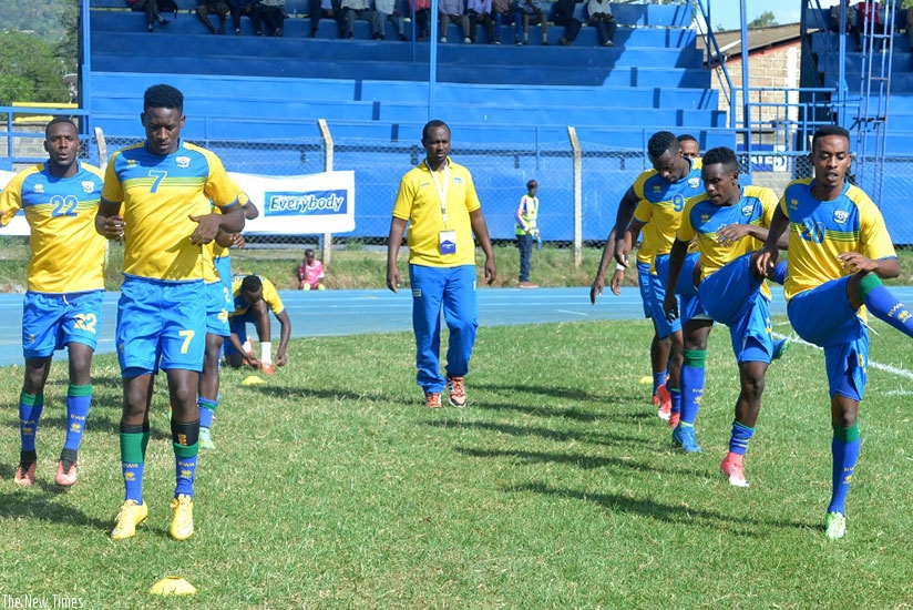 Amavubi players warming up before Thursdayu2019s game against Libya, which ended 0-0. Rwanda will face Tanzania today in their last game in the tournament. Courtesy.