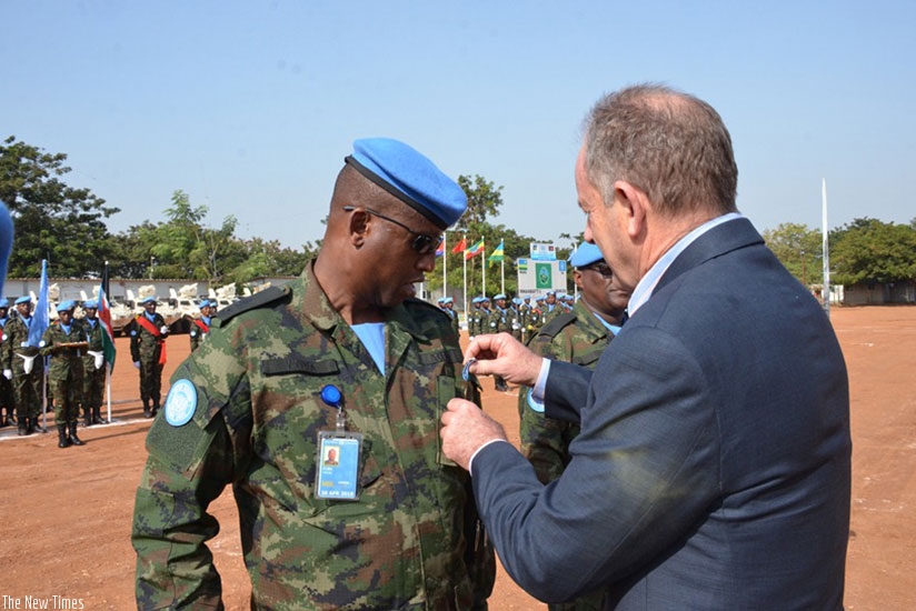 RWANDBATT1 Commanding Officer Lt Col Vianney Cuba being decorated by the Special Representative of the UN Secretary General, David Shearer, in Juba, yesterday. Courtesy. 