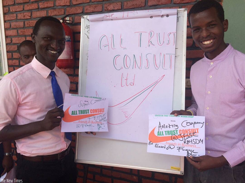 The young entrepreneur (left) and a colleague during one of the firm's activation and promotion campaigns. / Joan Mbabazi