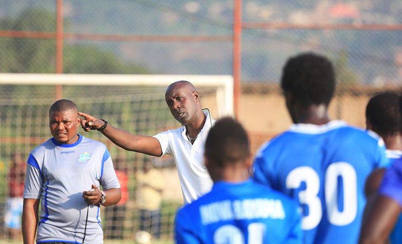 Karekezi gives instructions to his players at Nzove ground on his first day back to work after his release from police custody about a week ago. / Sam Ngendahimana