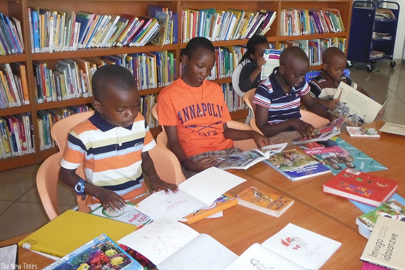 Children read story books in a library. Let this holiday also be a moment to share with your colleagues stories that you have read. Inspire others to read. (Dennis Agaba)
