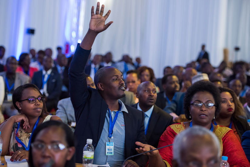 A participant seeks to ask a question during last year's Umushyikirano. / File
