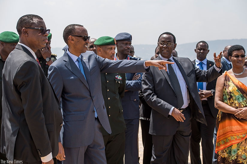 President Paul Kagame, flanked by senior political and military figures, gestures at Parliament in Kimihurura, where he inaugurated the Campaign Against Genocide Museum, yesterday.....