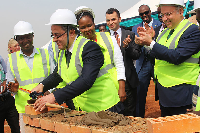 Amb.Youssef Imani and other officials lay a foundation stone at the Special Economic Zone in Kigali yesterday. Sam Ngendahimana. 