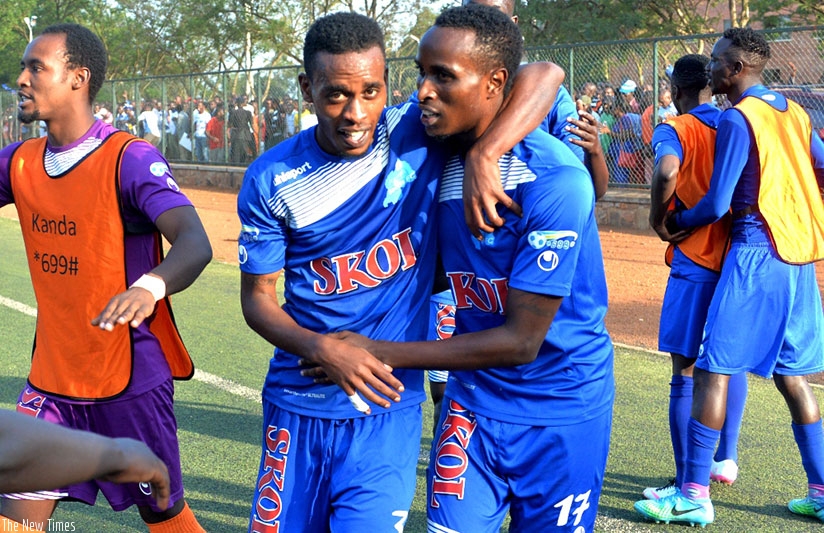 Goal scorer Eric Irambona, right, celebrates with teammate Eric Rutanga at the end of the match between Rayon Sports and Police FC at Kicukiro Stadium. Courtesy.