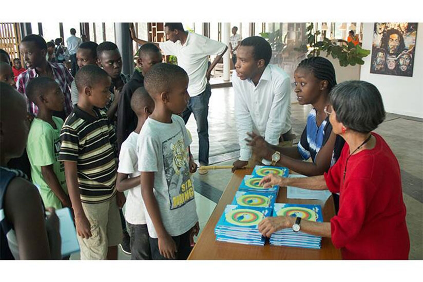 Children participating in the programme receive study material. / By Diane Mushimiyimana.rn