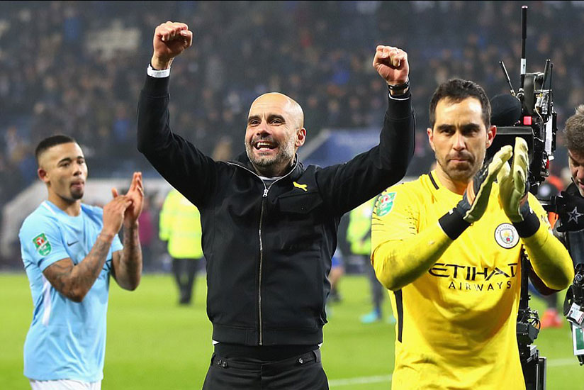 Guardiola, who is still looking for his first trophy in charge of City, salutes the travelling fans in the wake of their victory. / Net photo