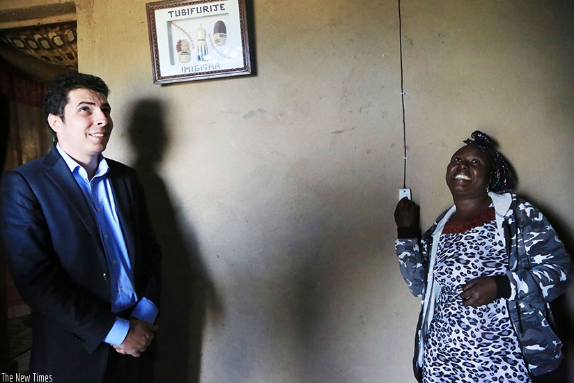 Hakan Karasoy, CEO at Hakan and Director of Yumn Ltd and a beneficiary look at the lighting. 