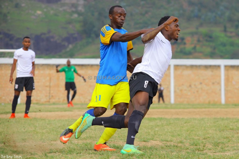 Innocent Ndizeye of Amagaju FC (L) recieved the first booking for a foul on APR midfielder Djihad Bizimana. Courtesy.