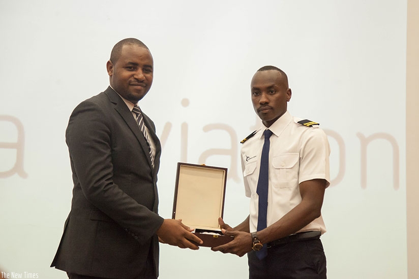 Kayumba (R) was awarded the best overall performer prize during the graduation ceremony. Nadege Imbabazi.
