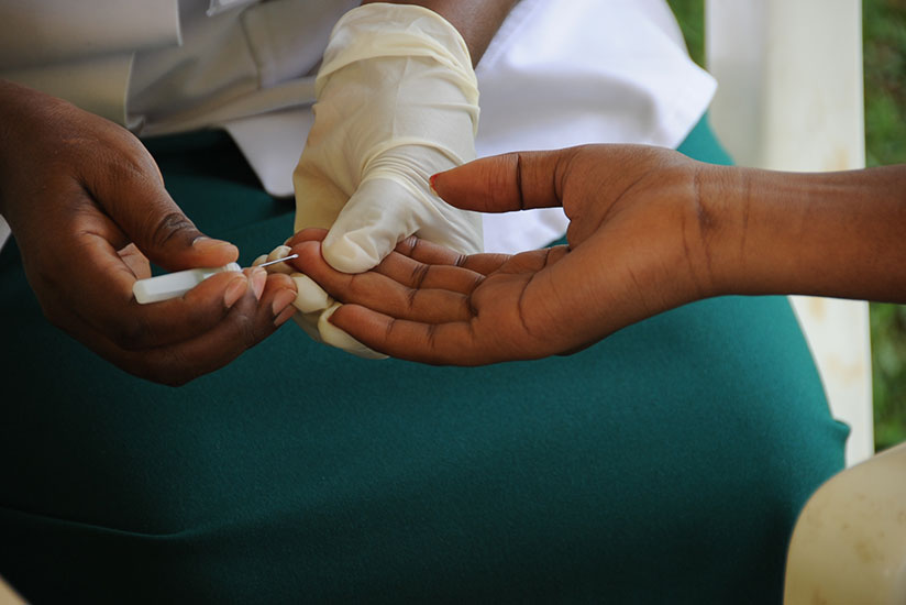 A volunteer testing for HIV at King Faisal Hospital. / Timothy Kisambira