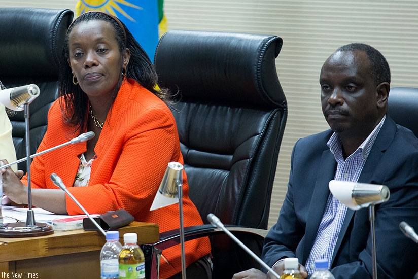 Minister Gashumba (L) speaks at parliament as Senator Dr Sezibera looks on. / Timothy Kisambira