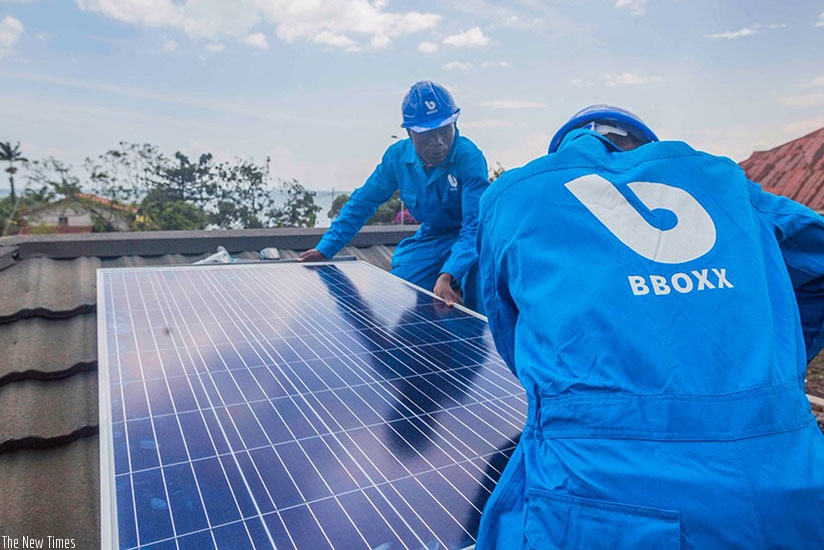 BBOXX technicians installing a solar panel. (Courtesy)