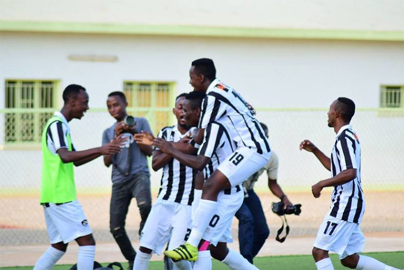 Muhadjir Hakizimana is mobbed by APR teammates after scoring against Musanze FC in a match that ended 1-1 on Wednesday at Kigali Stadium.  Courtesy